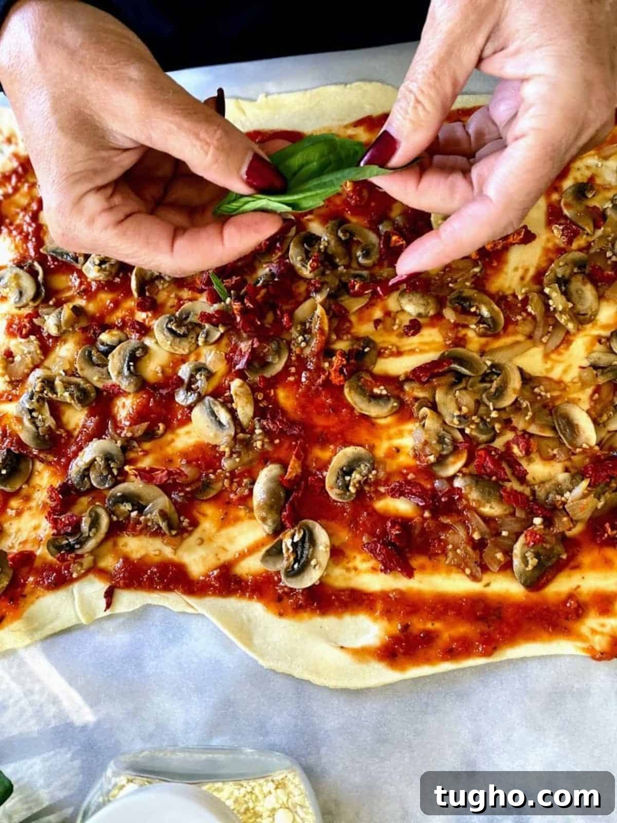 Vegan Pizza Pinwheels Recipe for Party Snacks 5 I am adding whole basil leaves generously to the vegan pizza pinwheel recipe.