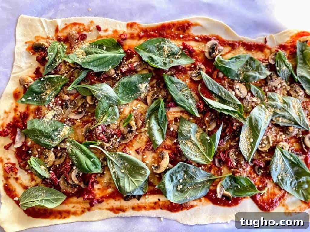 Vegan Pizza Pinwheels Recipe for Party Snacks 6 All the ingredients are evenly distributed on the base of the vegan dough.
