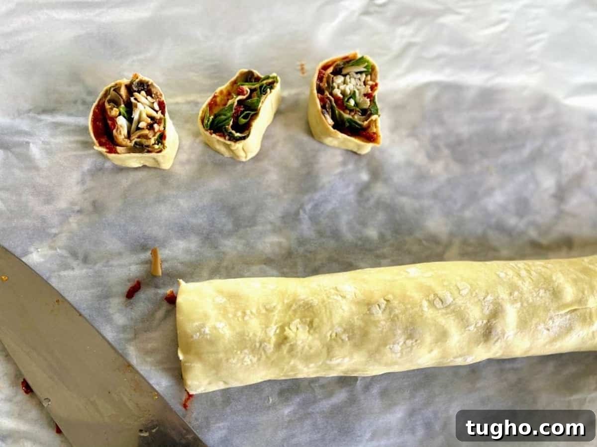 Vegan Pizza Pinwheels Recipe for Party Snacks 9 I cut the rolled dough into equal one inch slices.