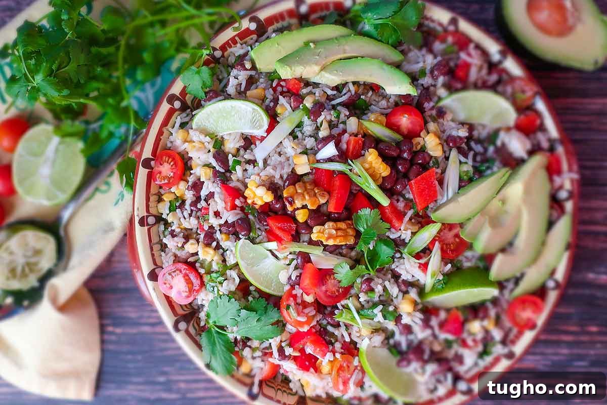 12 Must-Try Gluten-Free Grain Salad Recipes 10 garnished black bean rice salad with avocado, lime wedges and herbs