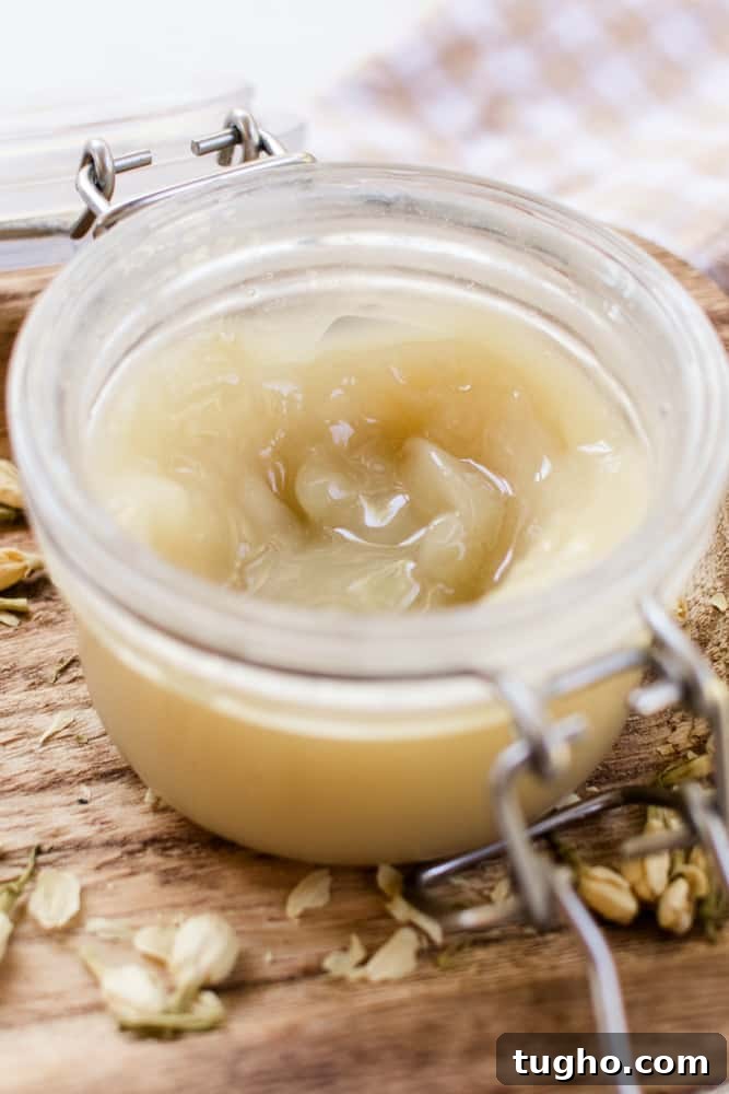 A close up jar of curl enhancing cream