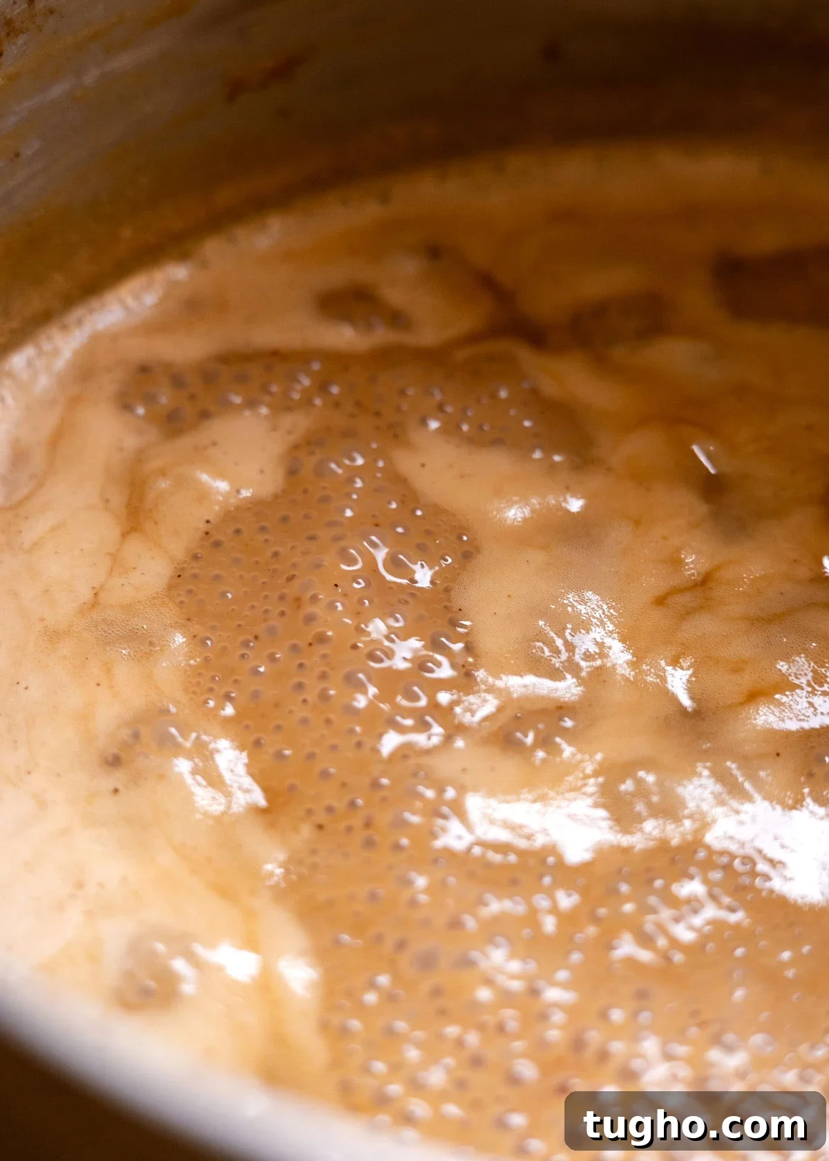 Cajeta: Authentic Mexican Goat Milk Caramel Recipe 7 cajeta simmering and thickening