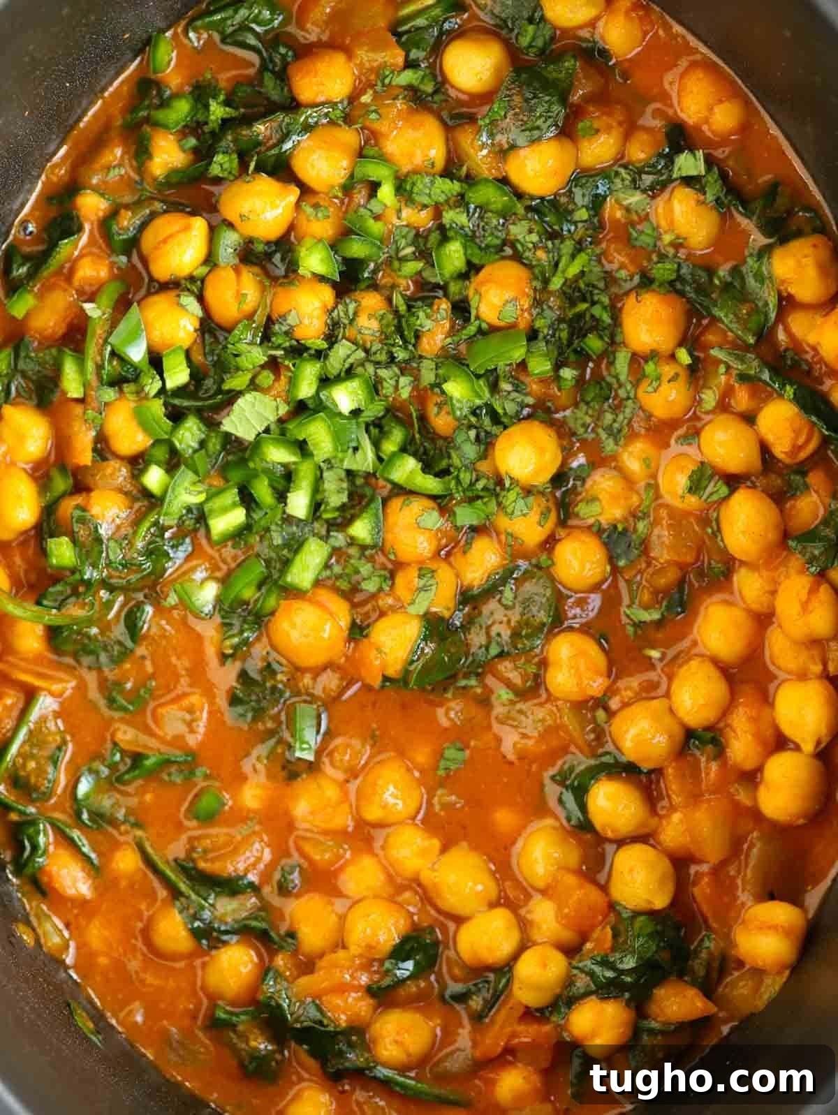 Slow Cooker Chana Saag: Chickpea Curry with Spinach 3 Close up of cooked curry with chickpeas.