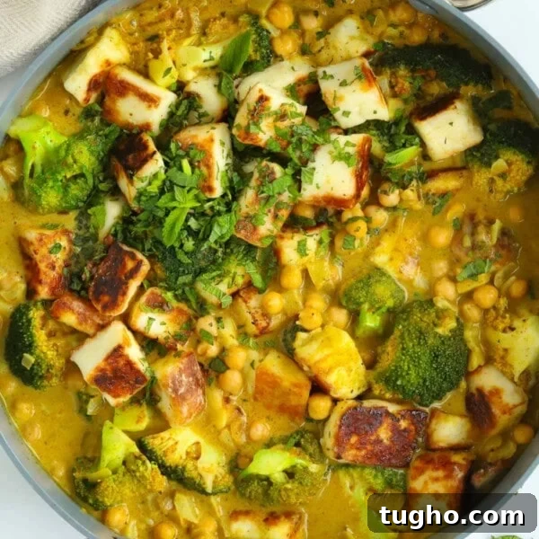 Slow Cooker Chana Saag: Chickpea Curry with Spinach 8 Pan full of delicious vegetarian curry made with halloumi, chickpeas and broccoli.