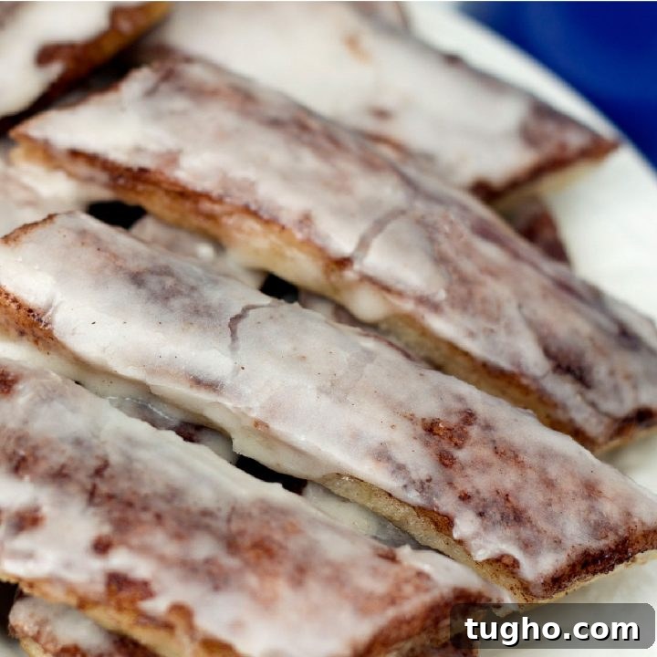 Pizza dough cinnamon sticks with frosting