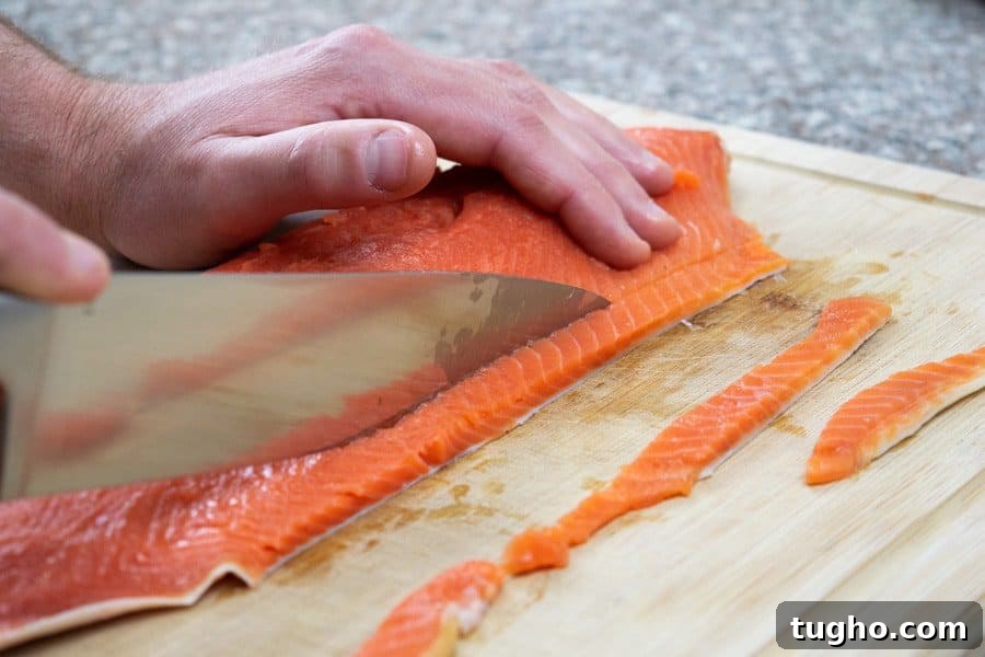 Slicing salmon fillet for salmon jerky