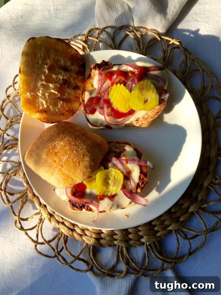 Grilled Pork Tenderloin Sandwiches, open-faced on a plate