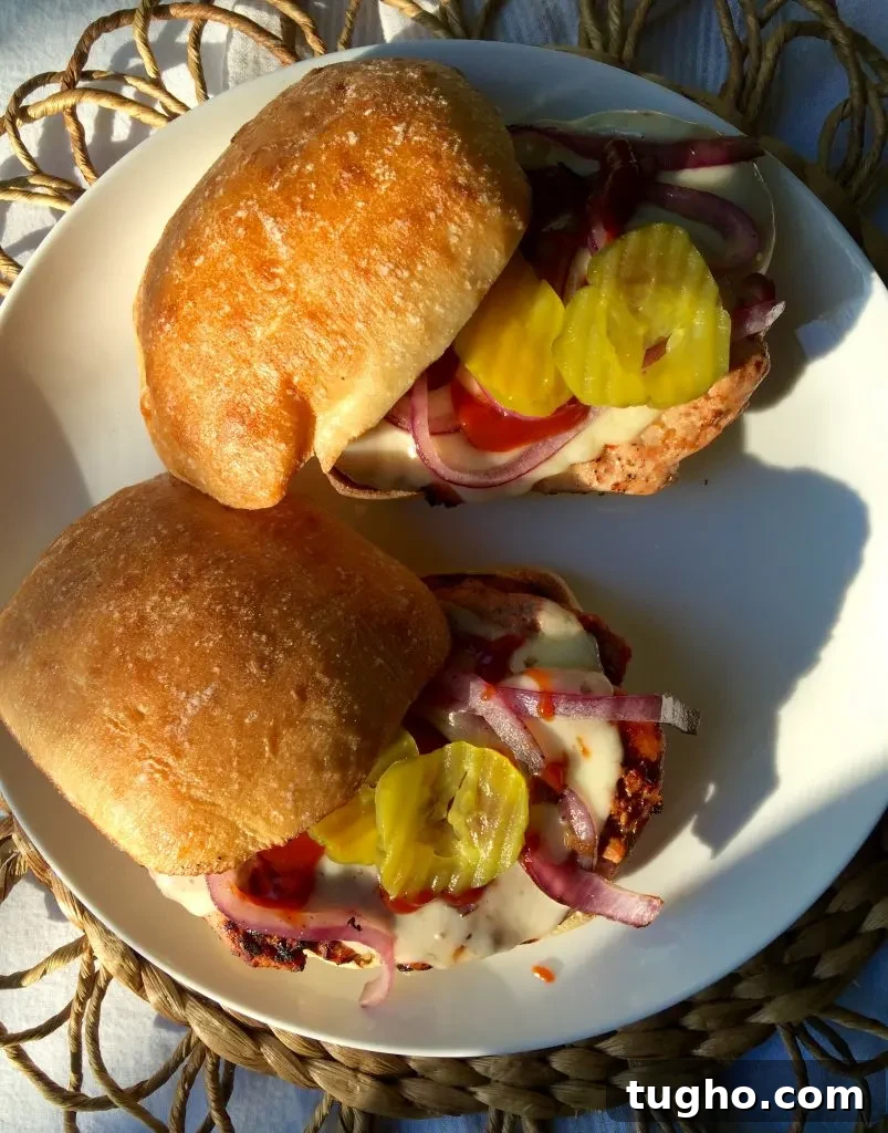 Grilled Pork Tenderloin Sandwich Recipe 6 Grilled Pork Tenderloin Sandwiches, two sandwiches on a plate