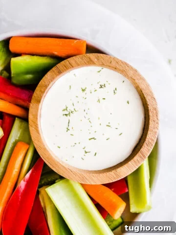 Ranch dressing in a bowl with vegetables
