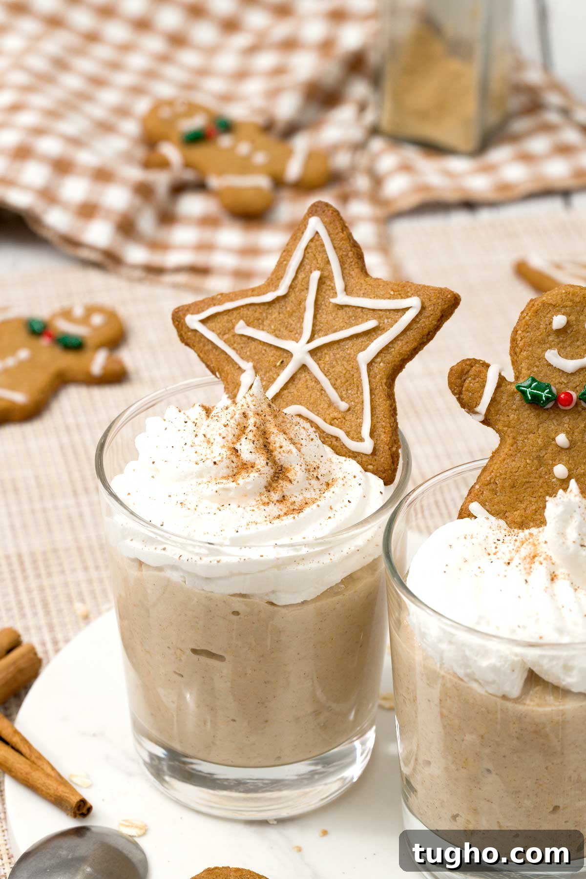 Gingerbread Overnight Oats with High-Protein Greek Yogurt 4 A glass of gingerbread overnight oats with a star shaped gingerbread cookie on top.