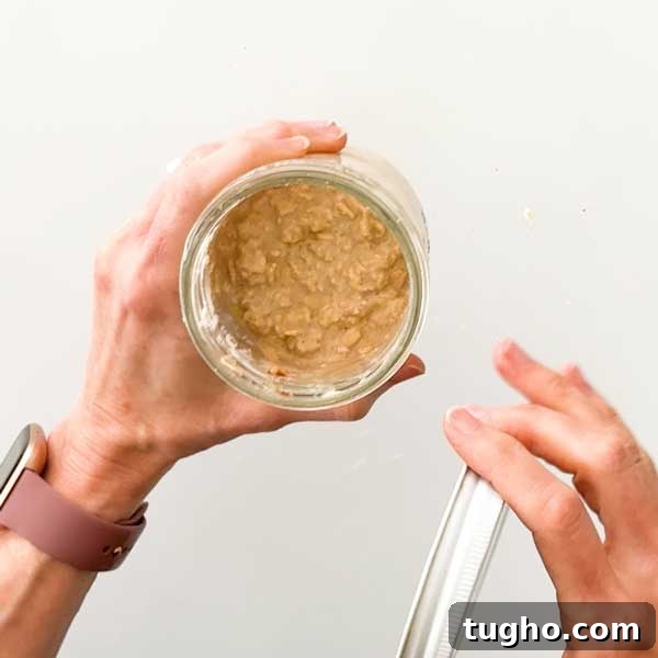 Gingerbread Overnight Oats with High-Protein Greek Yogurt 6 Jar of gingerbread overnight oats after Setting in the fridge overnight.