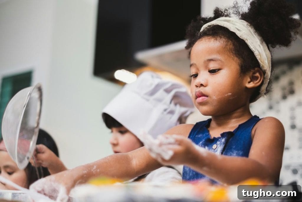 Create a Pretend Play Restaurant at Home for Kids 3 children baking and playing with flour in a pretend kitchen