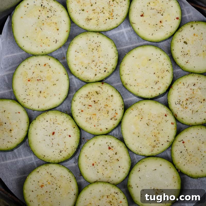 Sliced zucchini prepared for air fryer pizza bites