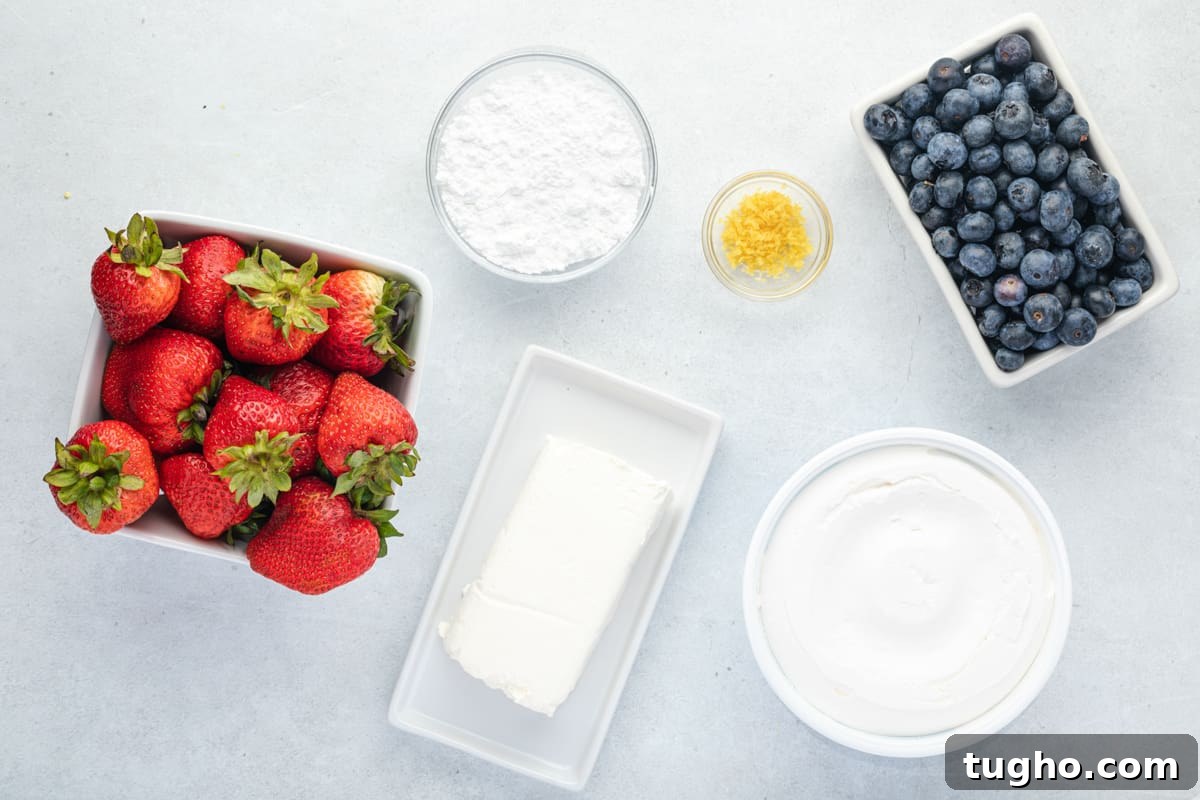 Patriotic Red, White and Blue Cheesecake Salad Recipe 9 Ingredients for cheesecake fruit salad: cream cheese, blueberries, strawberries, whipped toppings, and lemon zest.