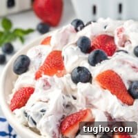 Patriotic Red, White and Blue Cheesecake Salad Recipe 4 berry cheese cake salad in a large serving bowl