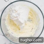 Patriotic Red, White and Blue Cheesecake Salad Recipe 6 Whipped topping added to cream cheese mixture.