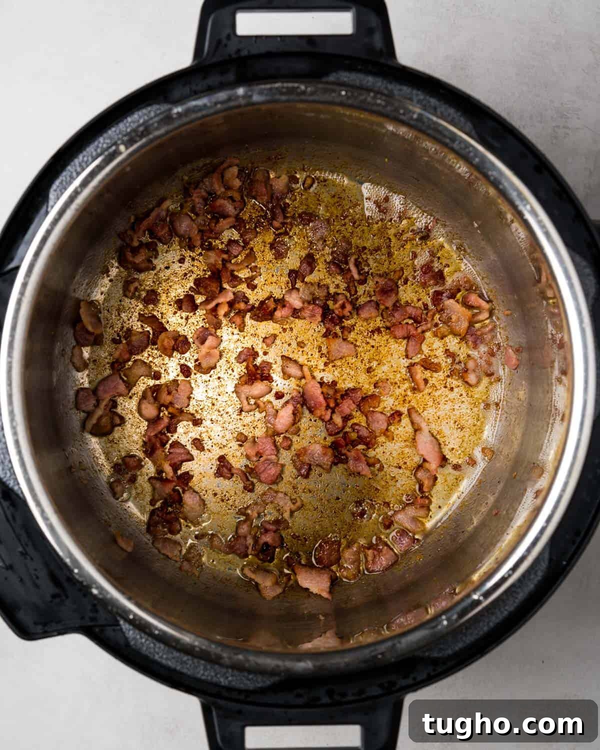 Instant Pot Chicken Stew with Tender Vegetables 6 cooking bacon in instant pot.