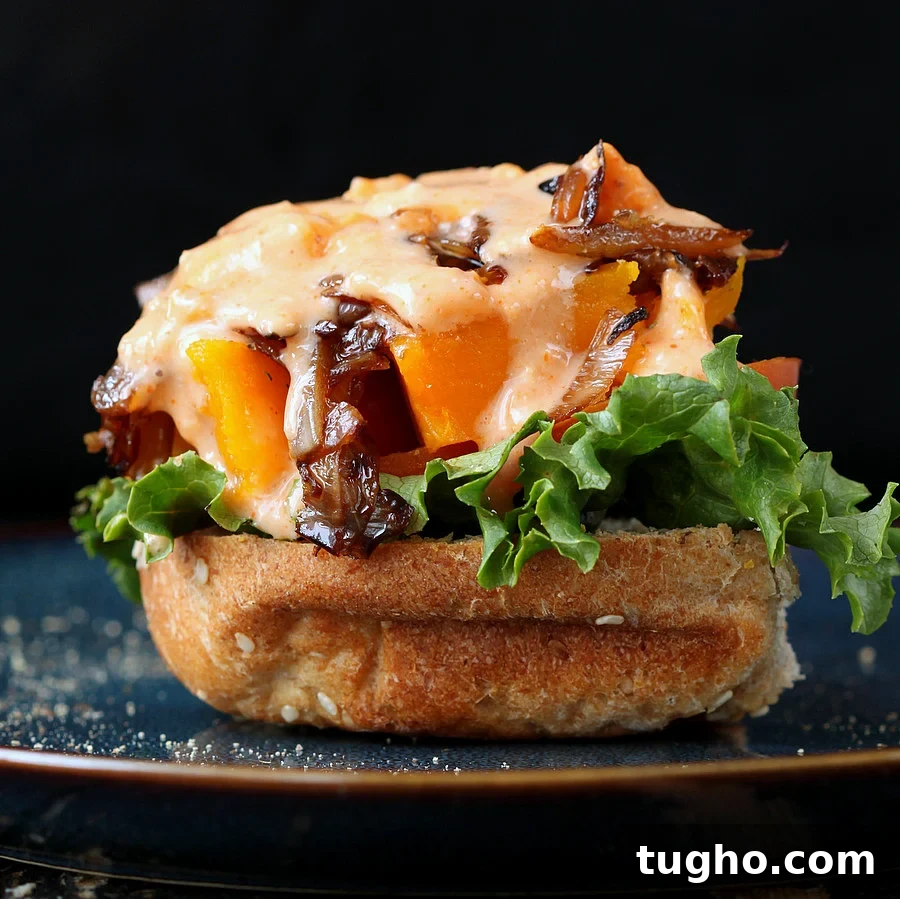 Roasted Butternut squash slider with balsamic caramelized onions and sriracha mayo
