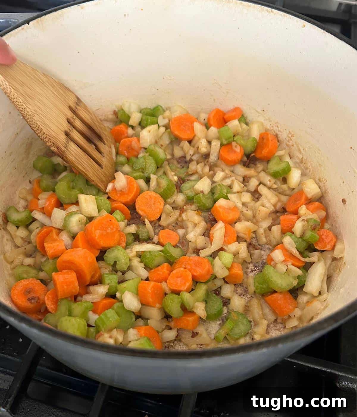 Dutch Oven Beef Stew with Tender Chuck and Vegetables 8 Carrot, celery, onion and garlic in roux in dutch oven.