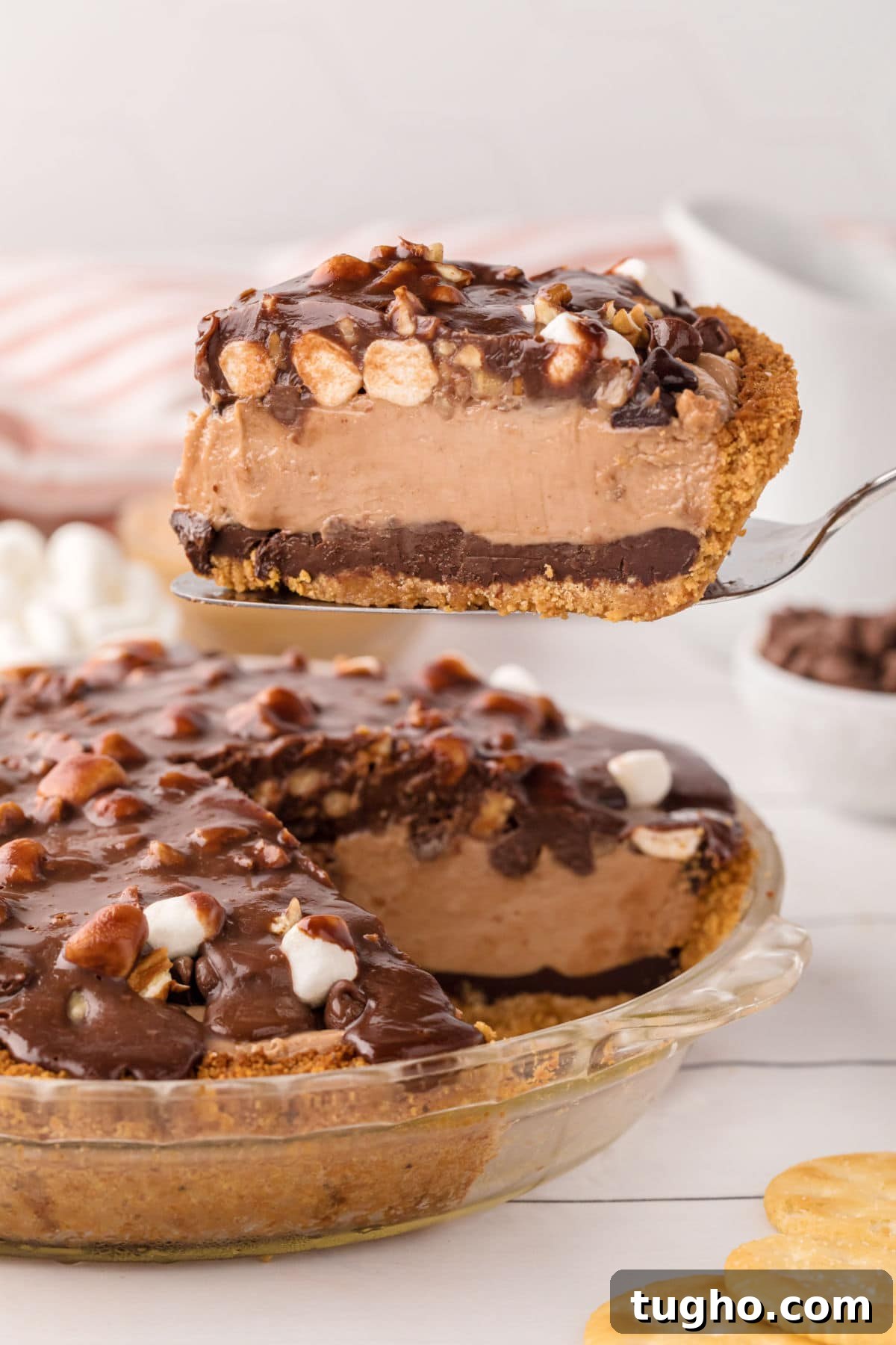 Authentic Texas Flood Pie Recipe 2 A slice of peanut butter and chocolate pie being lifted from the pie plate.