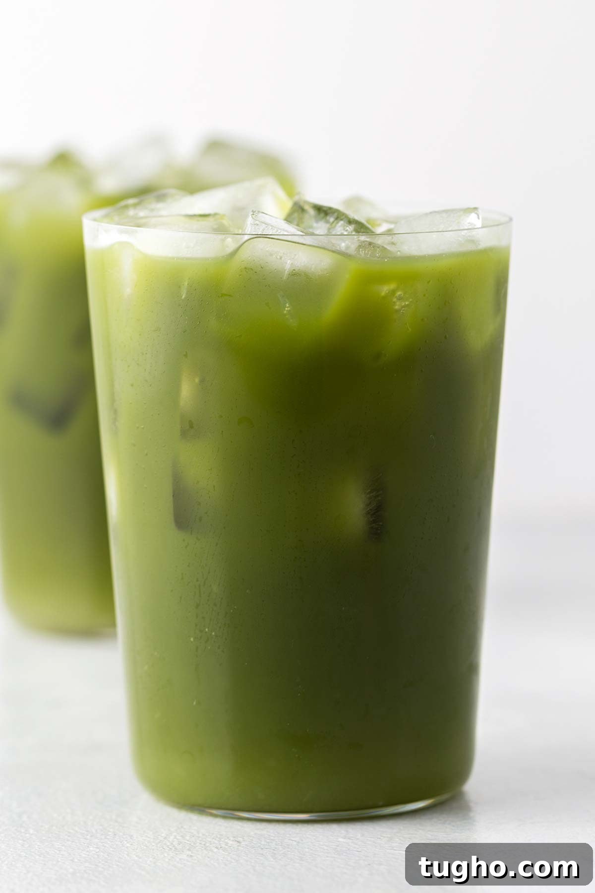 Layered Matcha Lemonade Recipe: Iced Citrus Green Tea 9 Matcha Lemonade in clear glass.