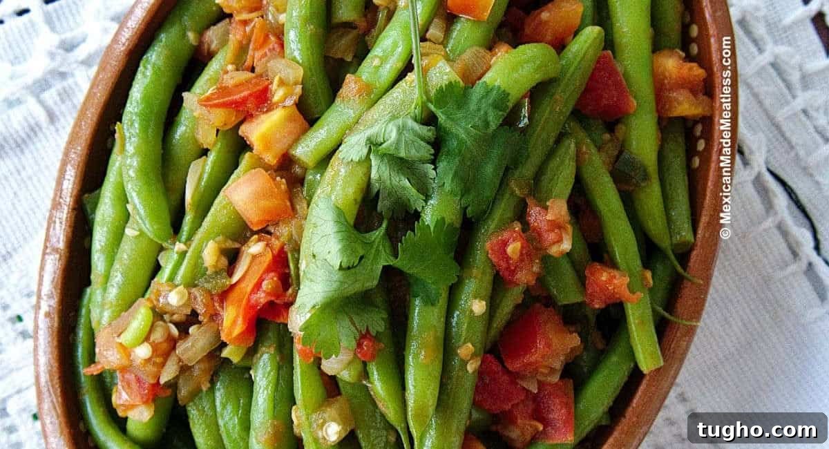Overhead image of ejotes a la Mexicana with garnish. 