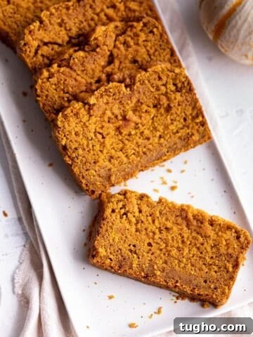Zesty Sourdough Lemon and Poppy Seed Muffins 11 A plate with slices of pumpkin bread.