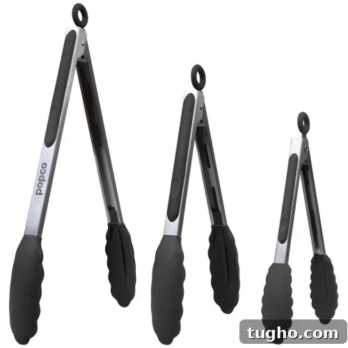 Three stainless steel kitchen tongs with black silicone grips.