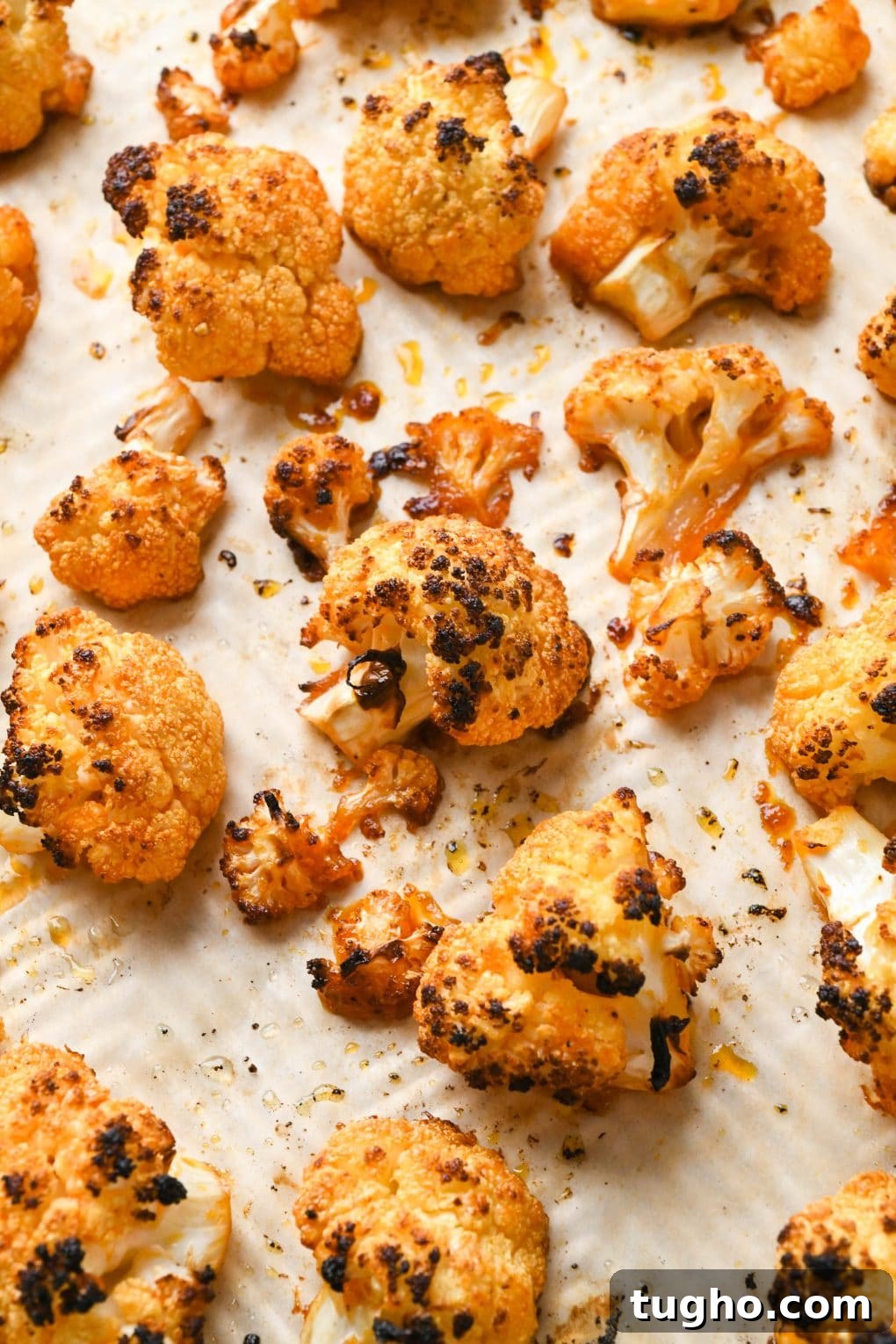 Roasted Buffalo Cauliflower Recipe (Dairy-Free) 3 Buffalo Cauliflower florets roasted on a sheet pan.
