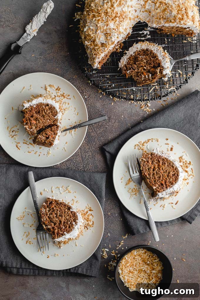 Dairy-Free, Eggless Coconut Carrot Cake Recipe 2 Overhead view of slices of carrot bundt cake arranged on white plates.