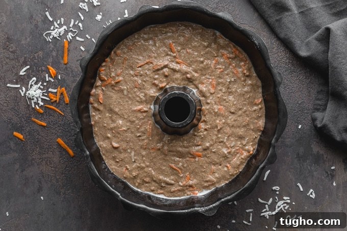 Dairy-Free, Eggless Coconut Carrot Cake Recipe 4 Egg-free carrot cake batter poured into a greased bundt pan.