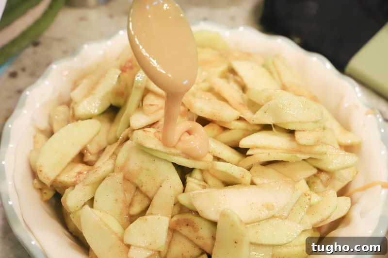 Caramel Dutch Apple Pie Recipe 5 adding caramel to the pie