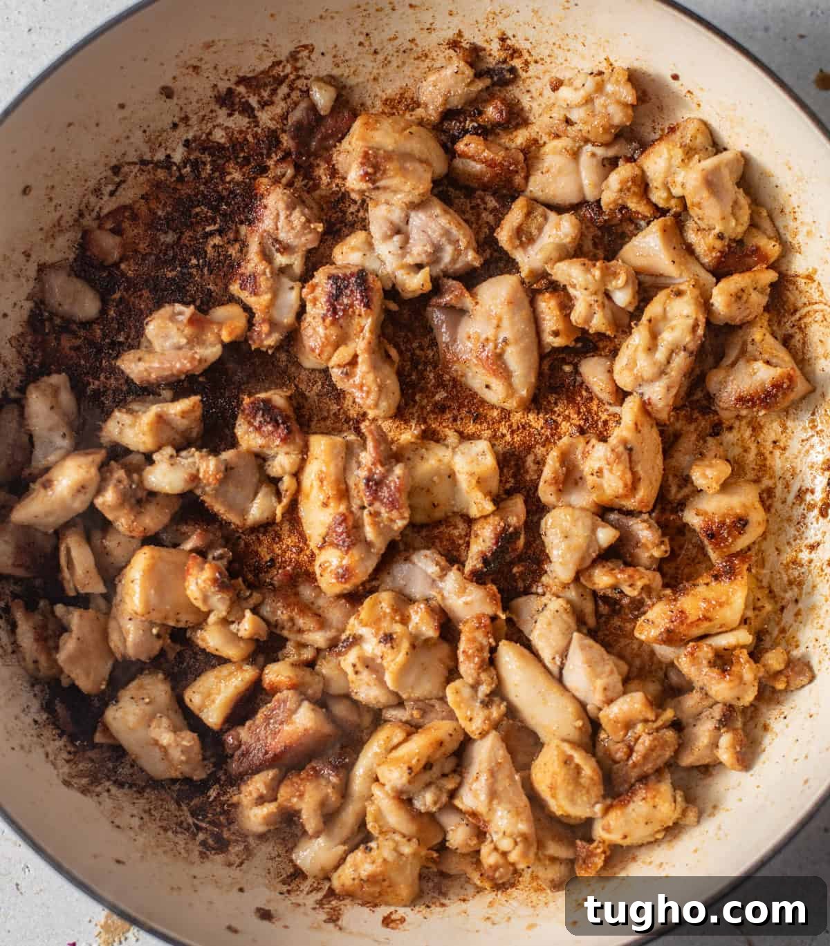 Creamy Chicken and Rice with Mushrooms 4 seared chicken and bacon in a pot.
