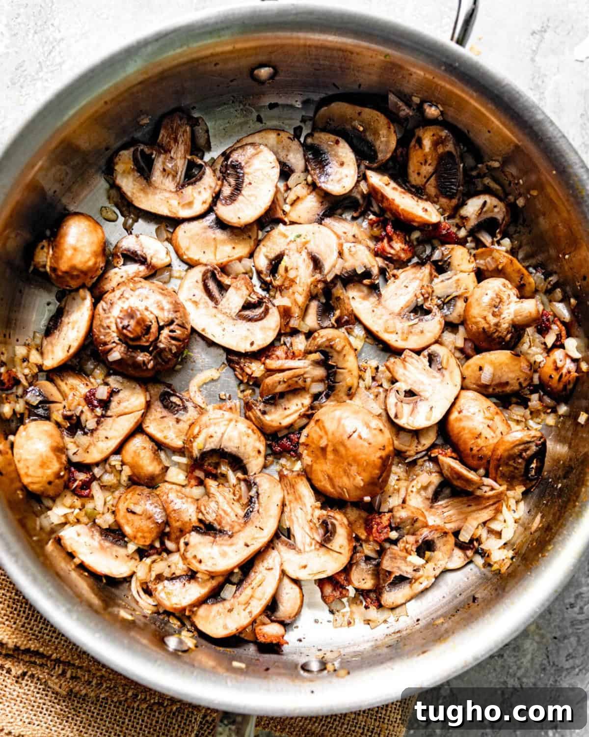 Creamy Chicken and Rice with Mushrooms 5 sauteed mushrooms, onions, and garlic in a pan.