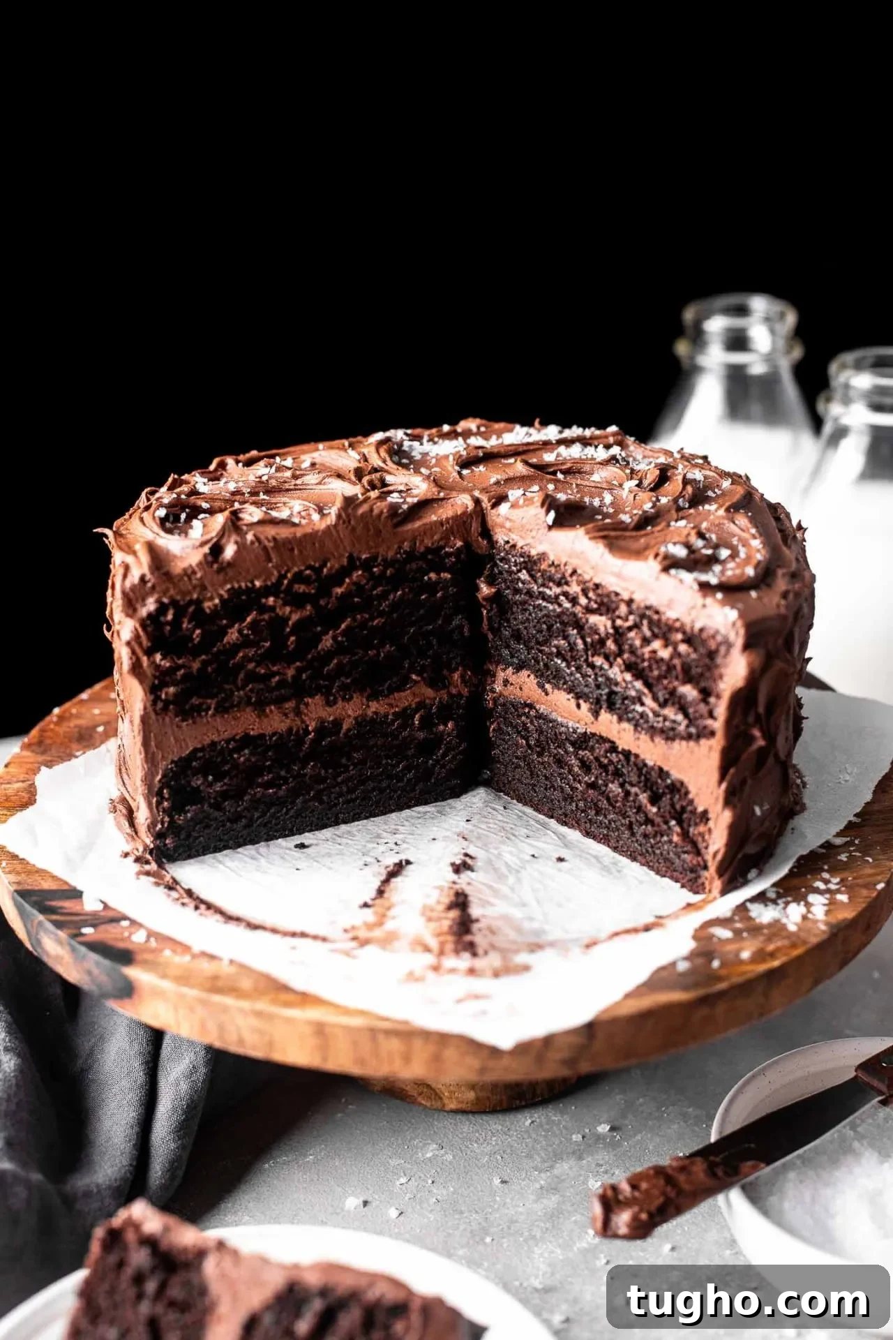 Fudgy Gluten Free Chocolate Cake Recipe 11 sliced gluten free chocolate cake on cake stand