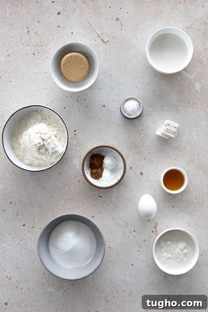 Homemade Baked Cinnamon Sugar Donuts Recipe 3 Ingredients for Baked Cinnamon Sugar Donuts in small bowls on a table.