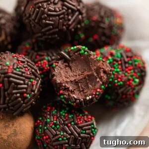 5 ingredient amaretto truffles on wax paper lined dish.