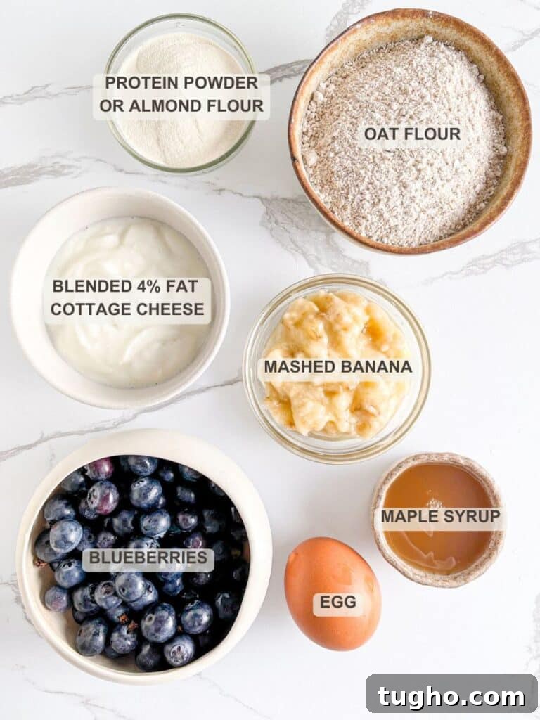 Moist Blueberry Muffins with Cottage Cheese 3 Cottage Cheese Blueberry Muffins Ingredients - Oat flour, protein powder or almond flour, blended cottage cheese, mashed banana, maple syrup, egg, fresh blueberries