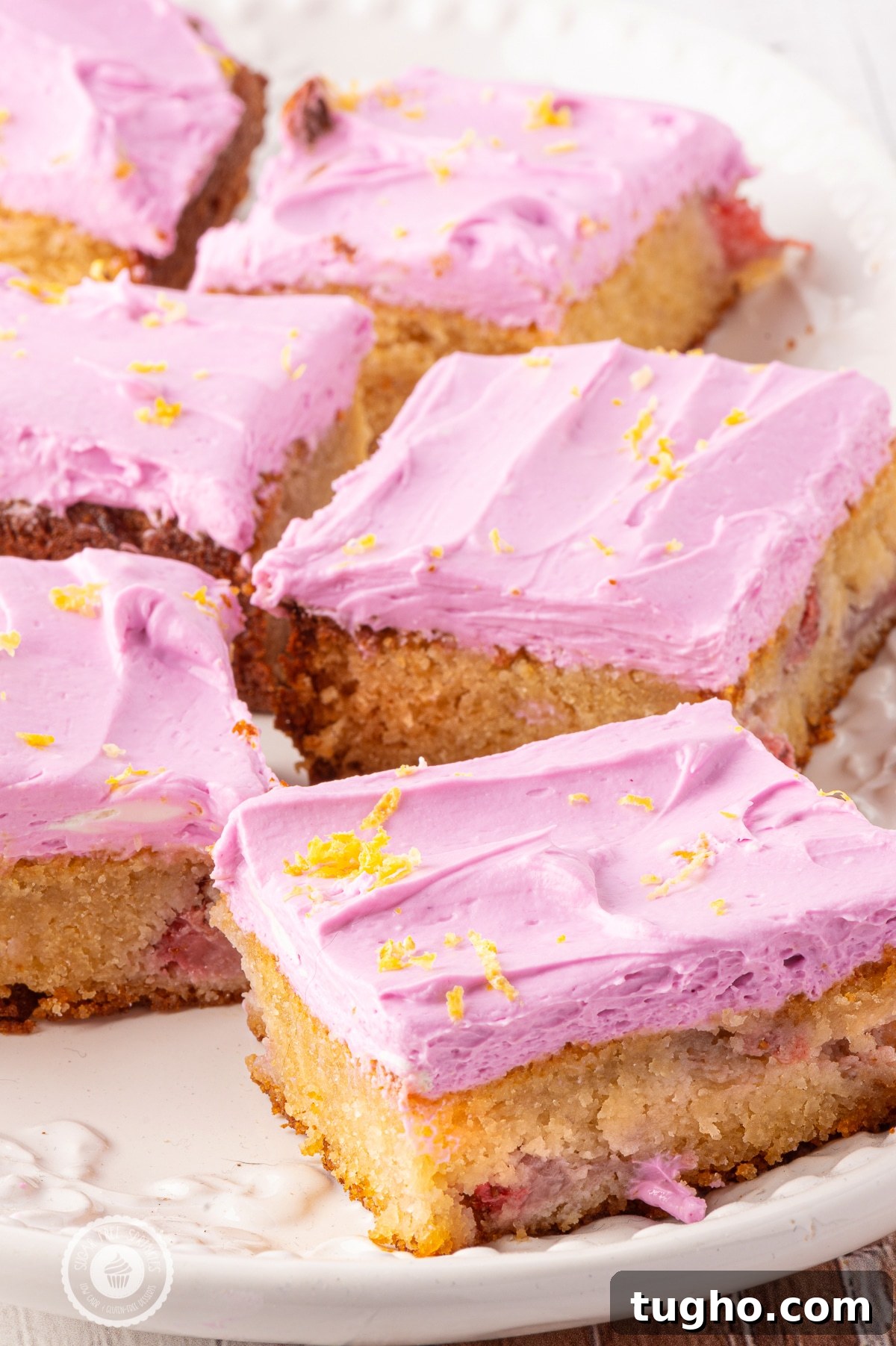 Low-Carb Strawberry Lemon Blondies, Keto and Gluten-Free 6 A tray of pink frosted strawberry blondies.