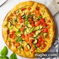overhead view of a zucchini tomato tart served on a plater