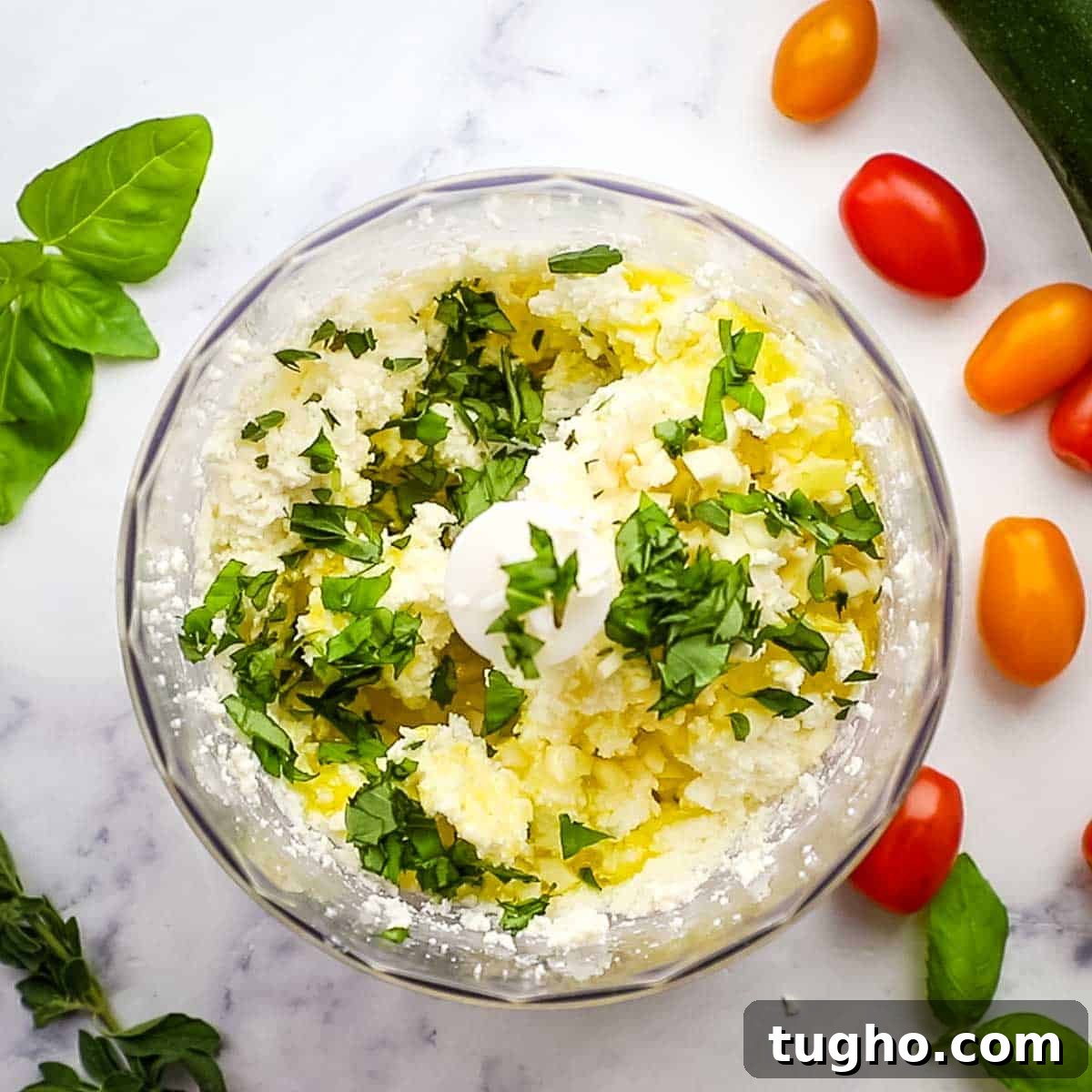 herbs and olive oil added to the feta and cream cheese mixture