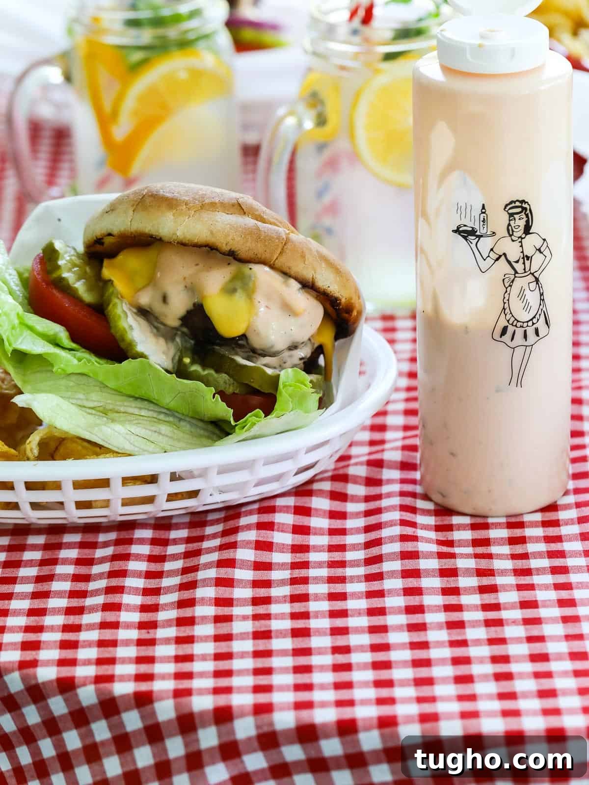Homemade Burger Sauce Recipe for Juicy Burgers 2 Bottle of burger sauce next to a grilled hamburger