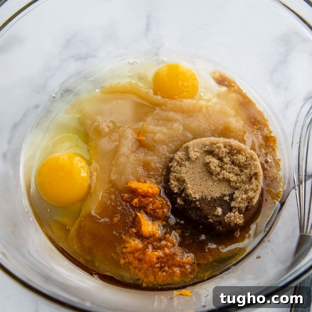 Gluten-Free Morning Glory Muffins: Moist One-Bowl Recipe 3 the eggs in a glass bowl with other wet ingredients.
