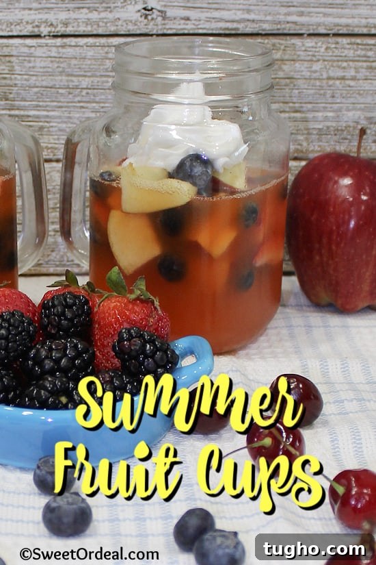 Clear glass with fresh fruit and gelatin, topped with frozen whipped topping.