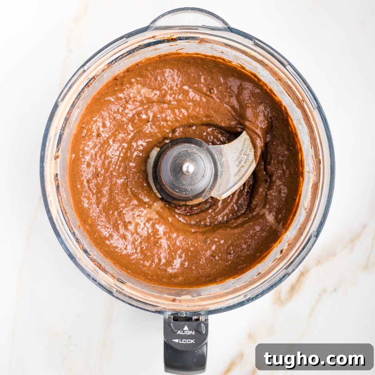 Fudgy Double Chocolate Zucchini Muffins Recipe 7 Chocolate batter in the bowl of a food processor.