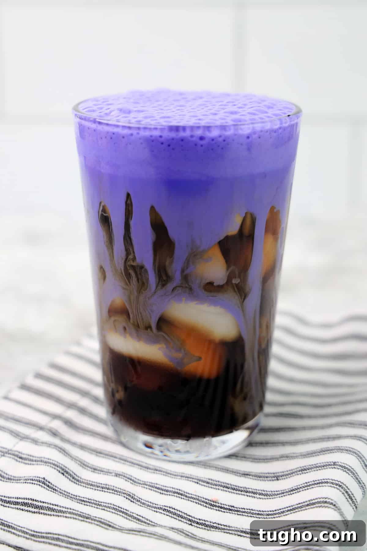 Pour purple cream over coffee