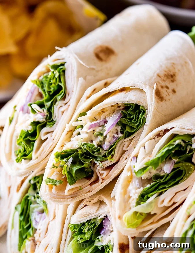 chicken caesar wraps cut in half on plate