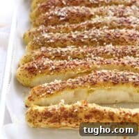 Pesto Parmesan Pull Apart Breadsticks Recipe 8 A baking sheet of Pesto Parmesan Pull Apart Breadsticks