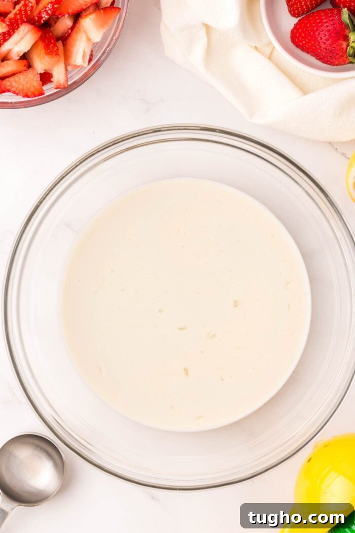 Classic Vegan Strawberry Shortcake Recipe 5 A large bowl of almond milk.