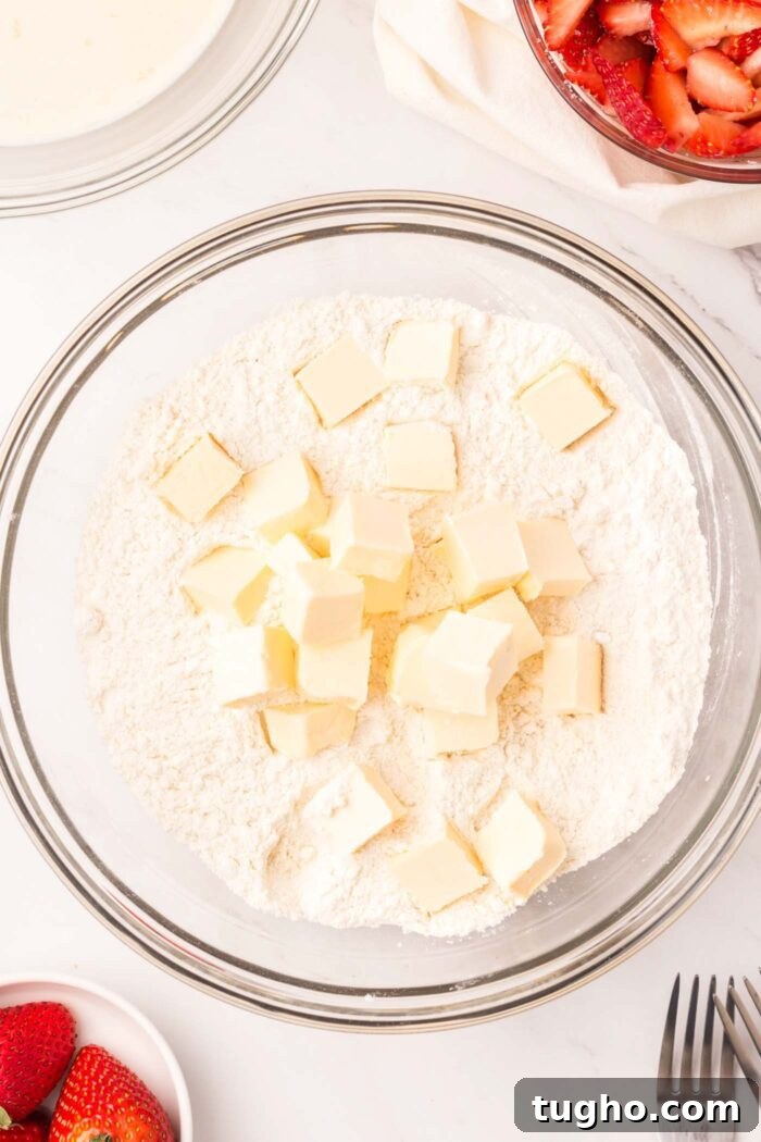 Classic Vegan Strawberry Shortcake Recipe 7 Cubed butter in a bowl of flour.